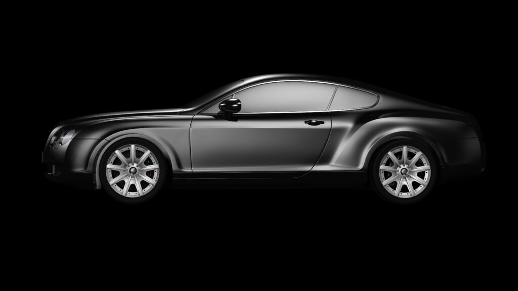 A side profile of a luxurious black coupe on a plain black background, showcasing elegance.